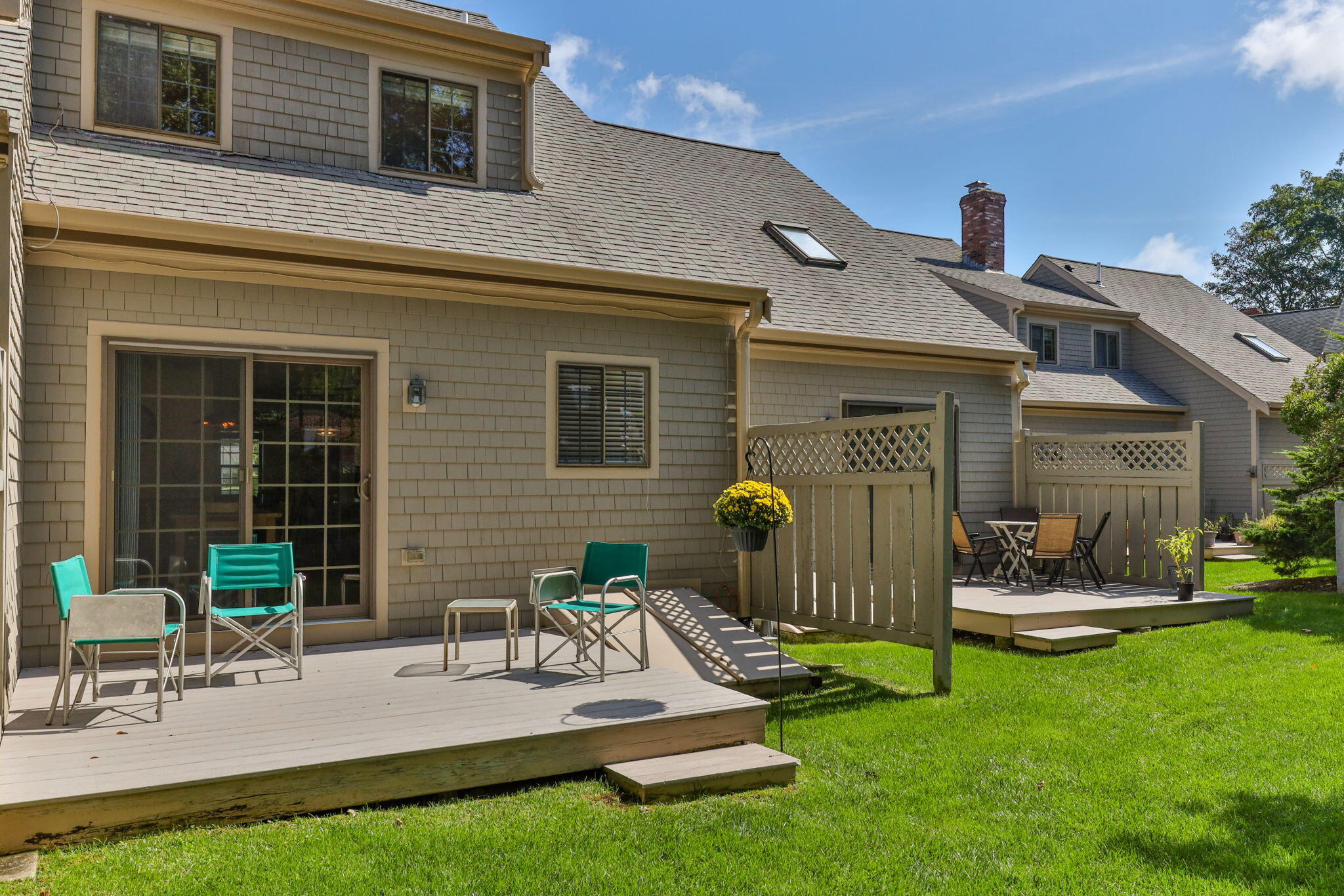 45 West Road, Unit 1E Orleans, MA 02653 - Photo 28 of 37 a view of backyard of a house with outdoor seating