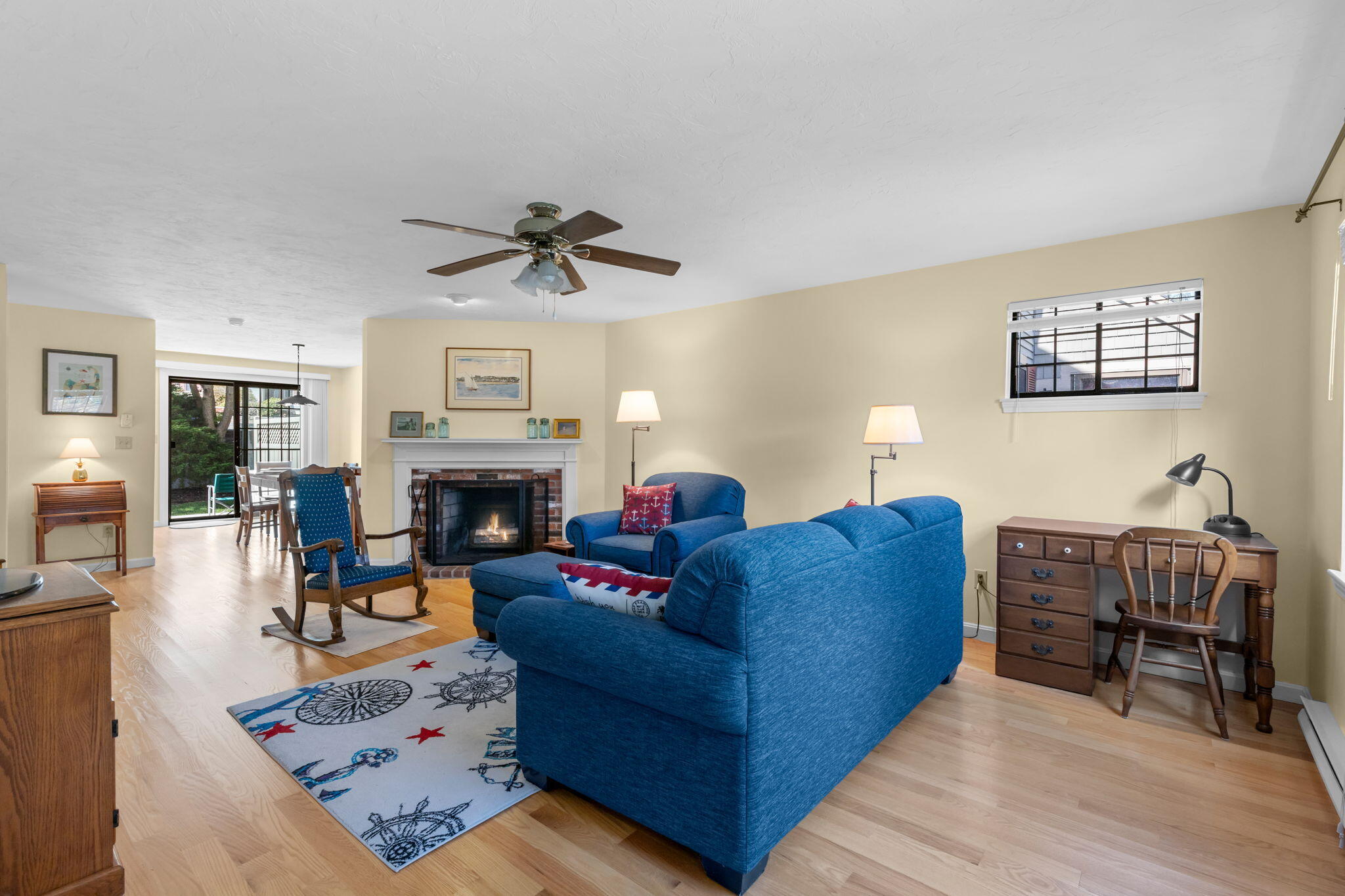 45 West Road, Unit 1E Orleans, MA 02653 - Photo 5 of 37 a living room with furniture and a fireplace