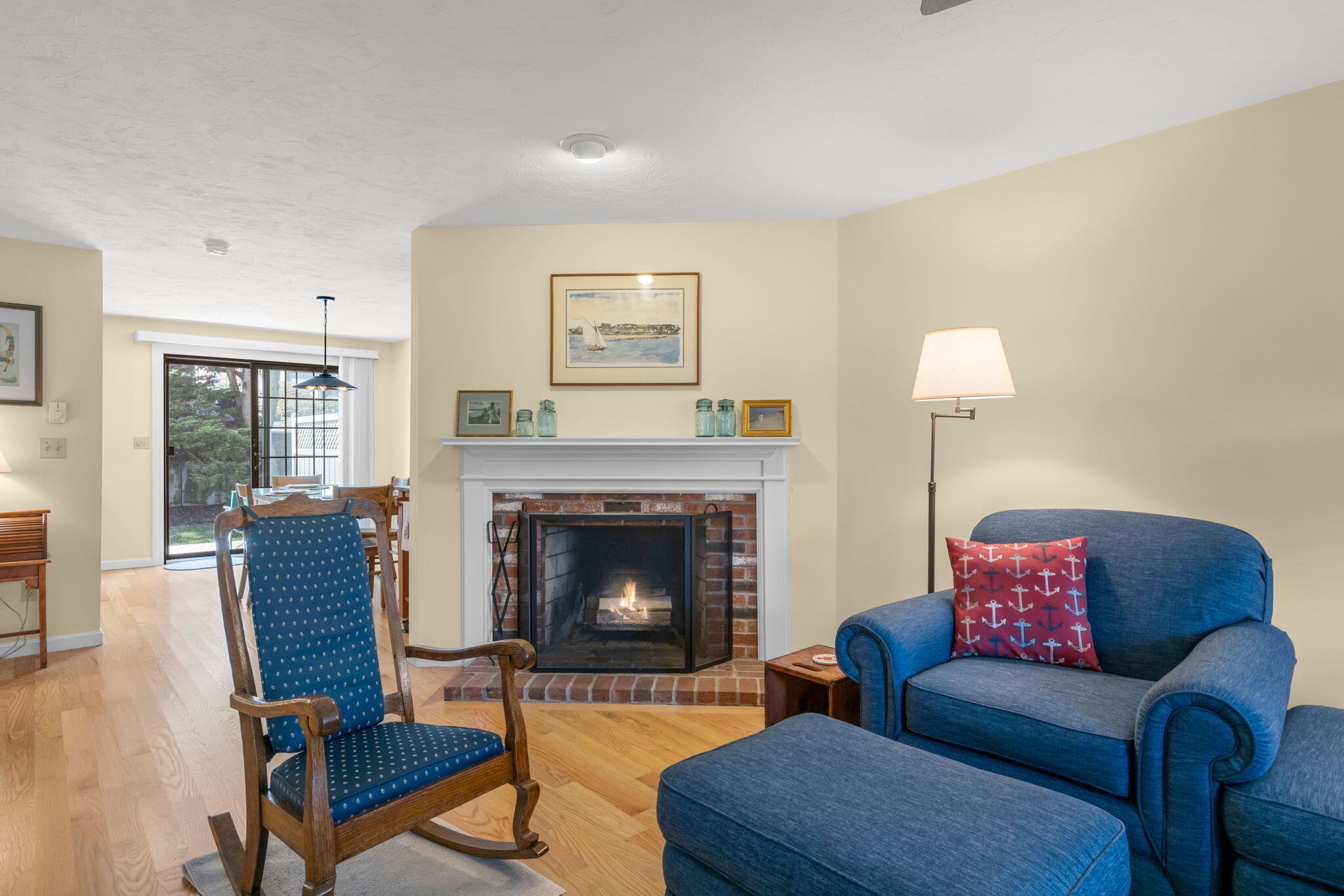 45 West Road, Unit 1E Orleans, MA 02653 - Photo 7 of 37 a living room with furniture and a fireplace