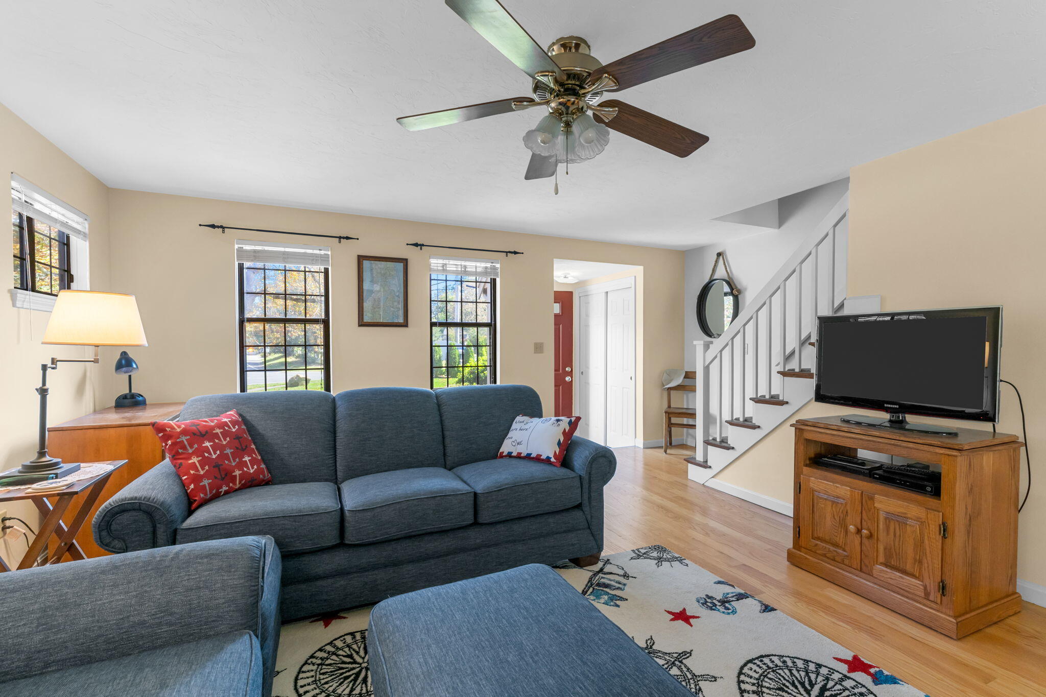 45 West Road, Unit 1E Orleans, MA 02653 - Photo 8 of 37 a living room with furniture and a flat screen tv