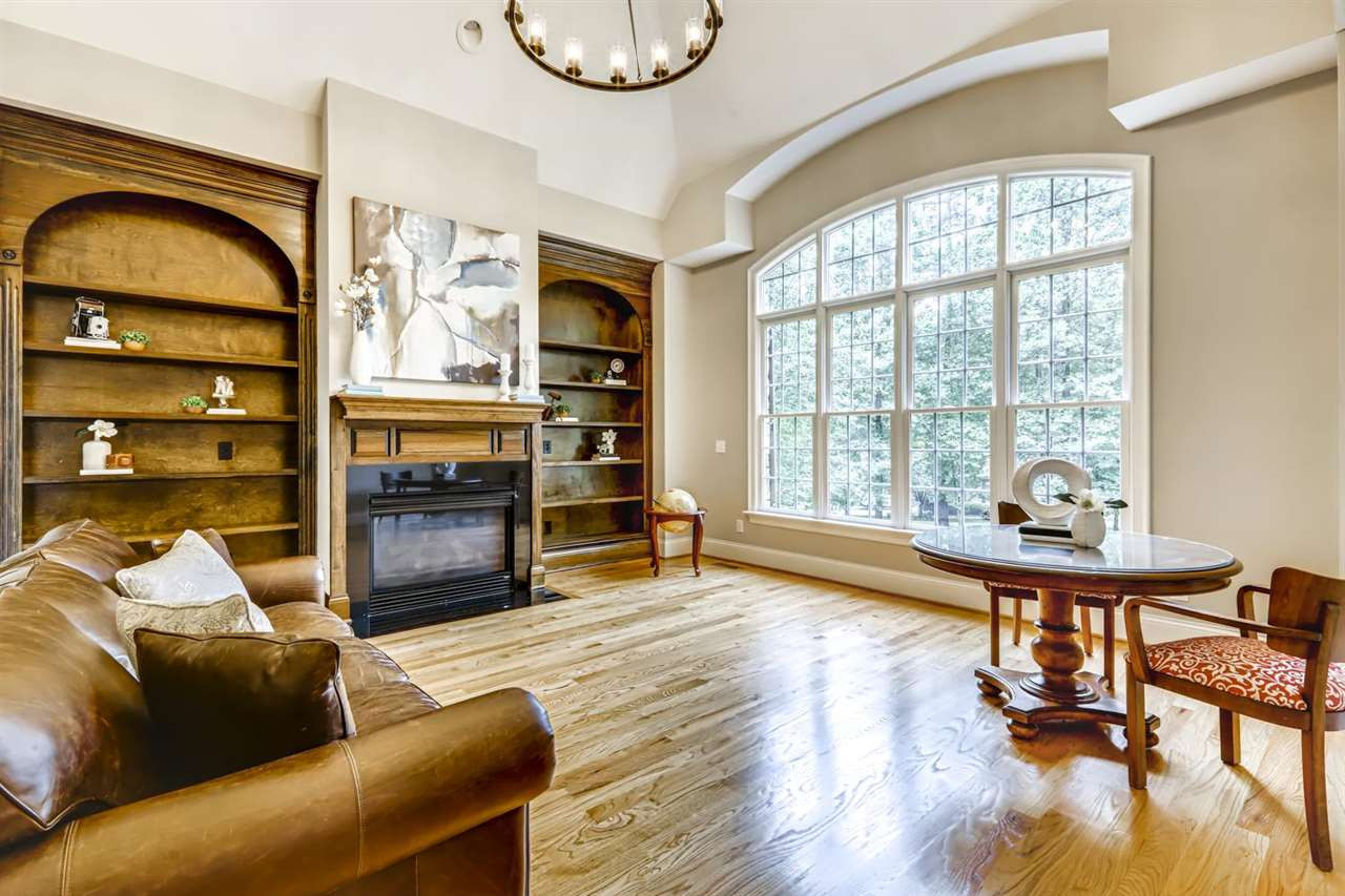 1408 Caistor Lane Raleigh, NC 27614 - Photo 1 of 18 Natural light flows into the private study. Gorgeous soaring ceiling with FIREPLACE and beautiful wood shelving. Refinished HARDWOODS and lots of privacy! Office/Study