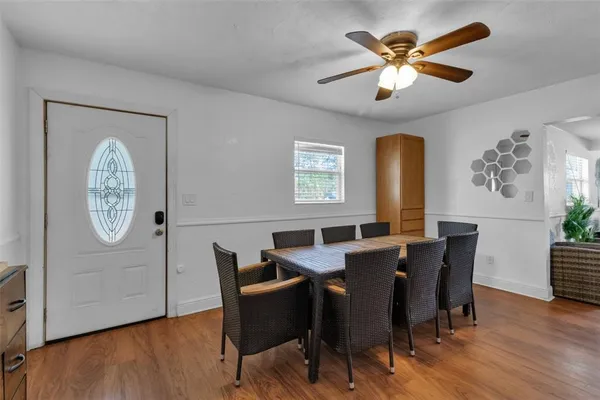 a view of a dining room with furniture window and wooden floor