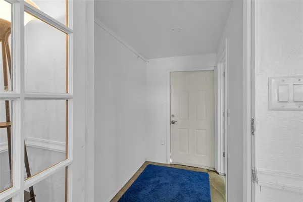a view of a workspace with furniture and wooden floor