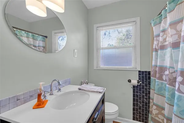 a bedroom with a bed and a table in it