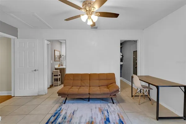 a bathroom with a sink mirror and shower