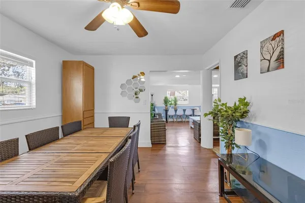 a backyard of a house with a table and chair