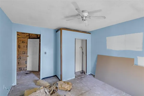 a front view of house with yard and trees