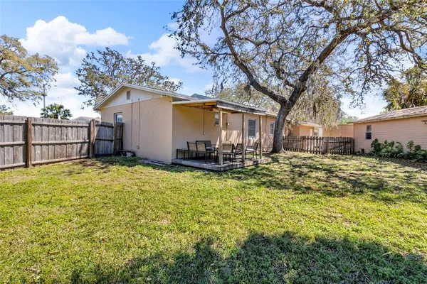 a view of backyard with outdoor seating
