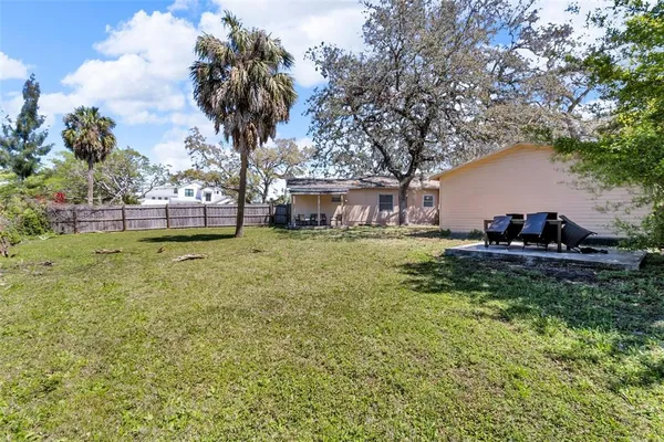 a view of a house with a small yard and plants