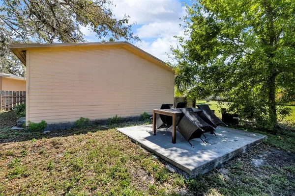 a view of a yard with a tree