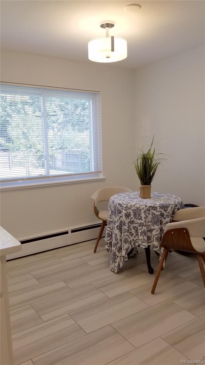 4630 Quay Street Wheat Ridge, CO 80033 - Photo 17 of 36 a bed sitting in a bedroom next to a window
