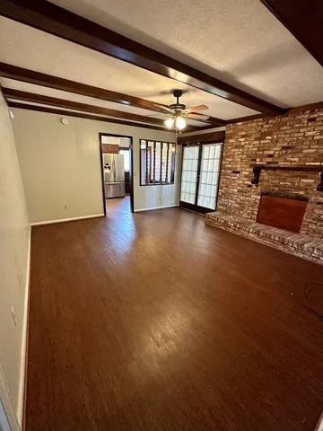 a view of a porch with wooden floor