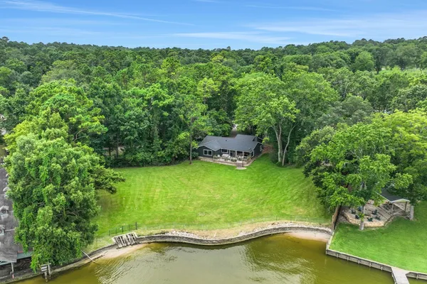 a view of a lake with a yard