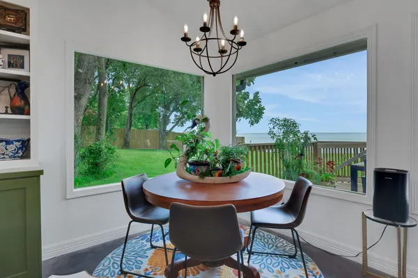 a view of a dining room with furniture window and outside view