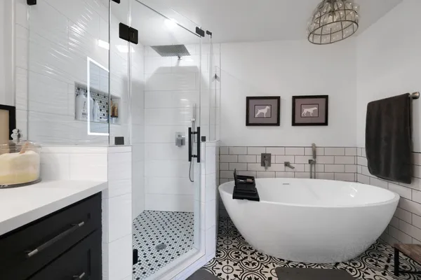 a bathroom with a bathtub and shower