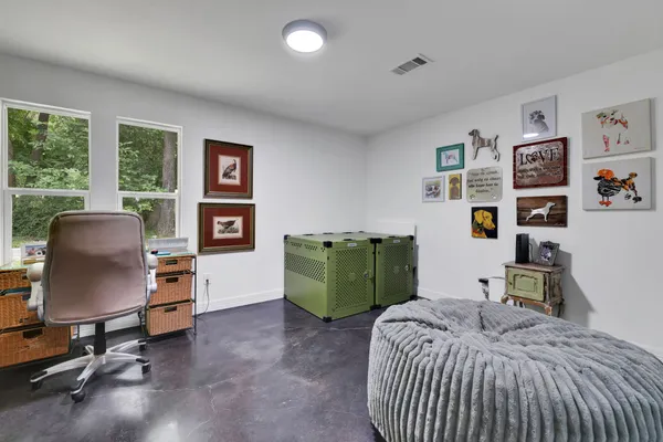 a bedroom with a bed and furniture