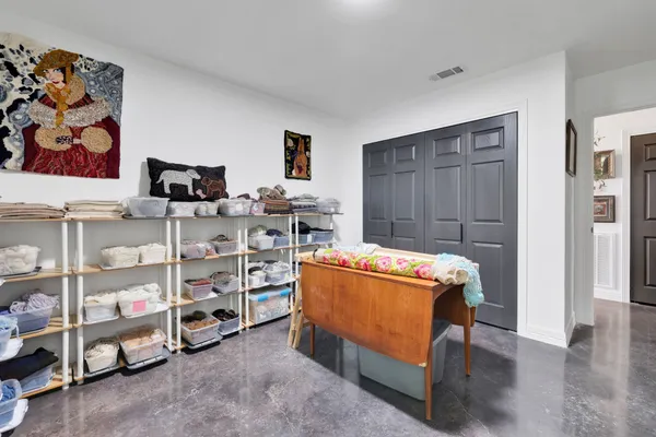 a bedroom with a bed and a cabinets