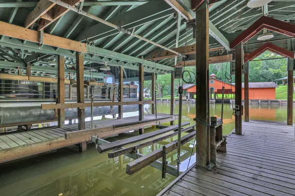 a roof deck with table and chairs