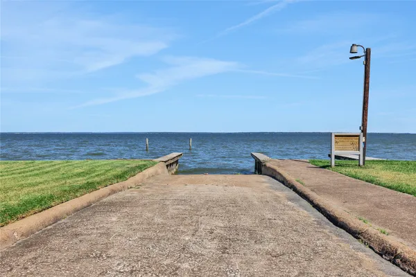 a view of a field with an ocean view