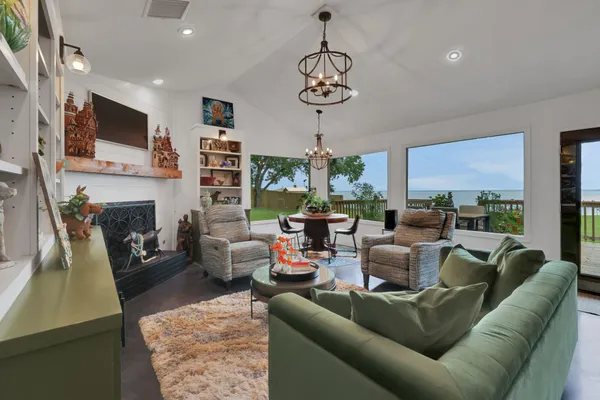 a living room with fireplace furniture and a flat screen tv