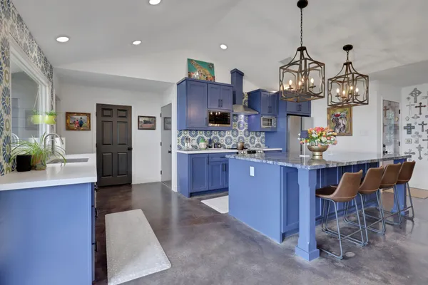 a view of a kitchen and dining room
