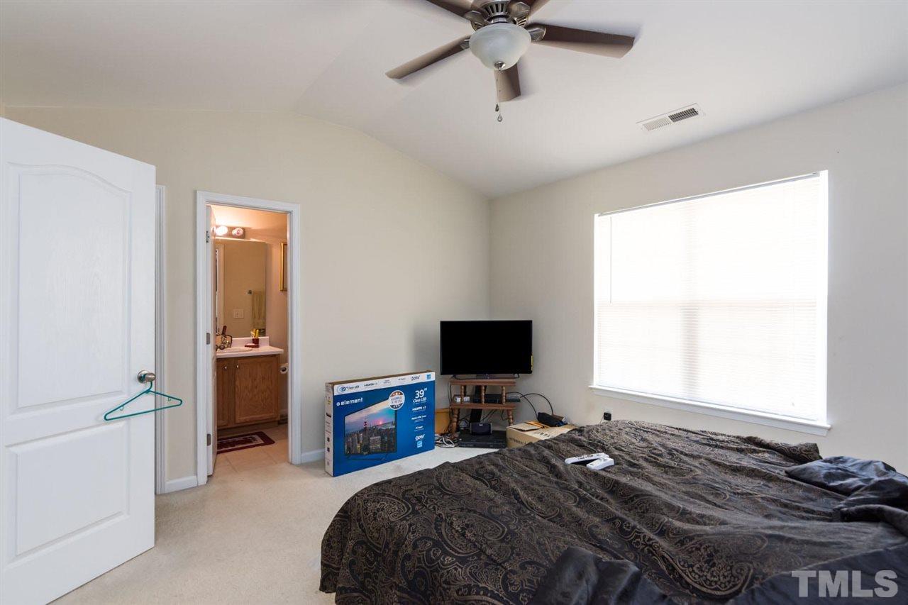 3515 Oneonta Avenue Raleigh, NC 27604 - Photo 12 of 13 a bedroom that has a bed and a flat screen tv