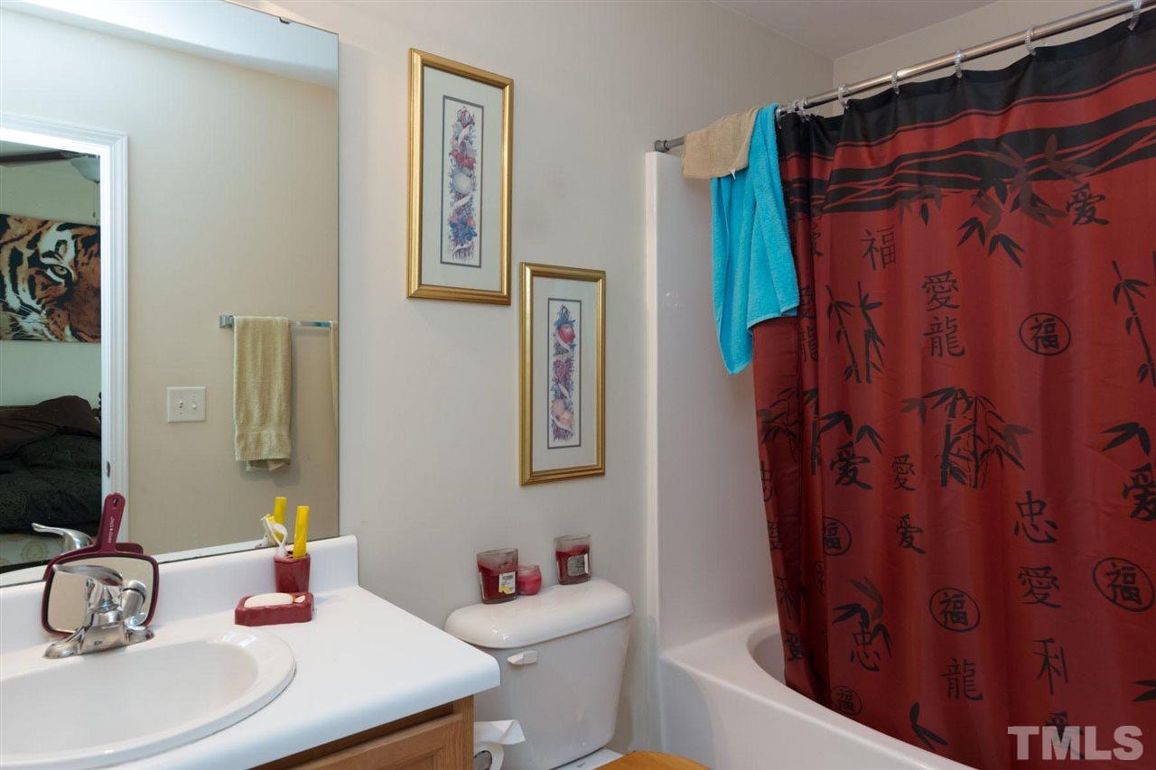 3515 Oneonta Avenue Raleigh, NC 27604 - Photo 13 of 13 a bathroom with a sink toilet and shower