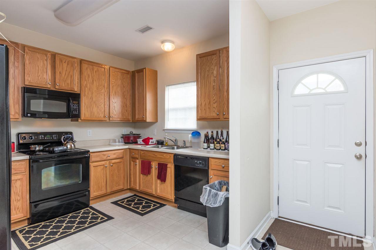 3515 Oneonta Avenue Raleigh, NC 27604 - Photo 4 of 13 a kitchen with granite countertop a stove and a sink