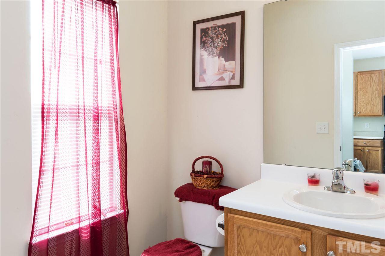 3515 Oneonta Avenue Raleigh, NC 27604 - Photo 6 of 13 a bathroom with a sink and a mirror