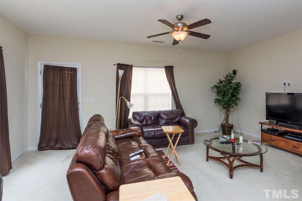 3515 Oneonta Avenue Raleigh, NC 27604 - Photo 8 of 13 a living room with furniture and a flat screen tv