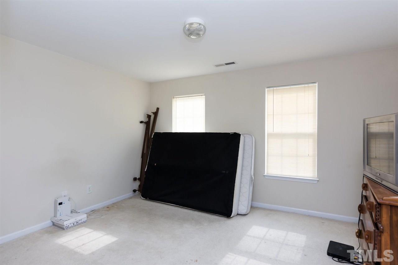 3515 Oneonta Avenue Raleigh, NC 27604 - Photo 10 of 13 a living room with a flat screen tv and a window