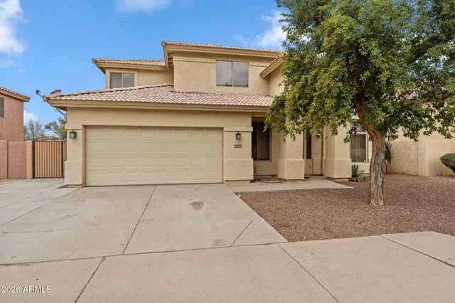 a front view of a house with garage