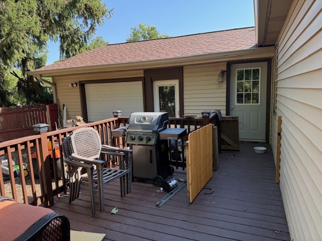 18400 South Parker Road Mokena, IL 60448 - Photo 11 of 31 a view of a patio with table and chairs with wooden floor and fence