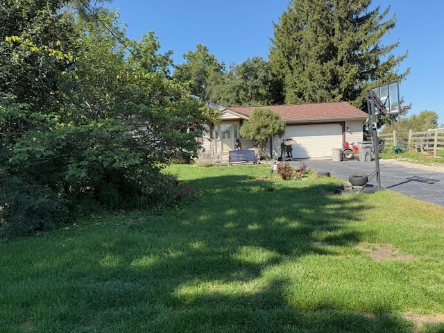 18400 South Parker Road Mokena, IL 60448 - Photo 29 of 31 a front view of a house with a garden and trees