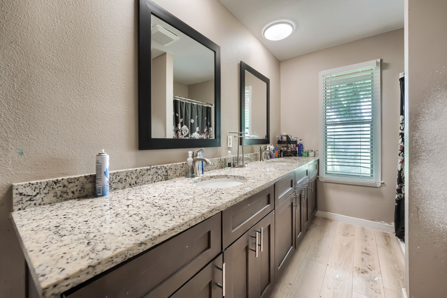 14520 Bois-D-Arc Road Manor, TX 78653 - Photo 7 of 21 a bathroom with a granite countertop sink and a mirror