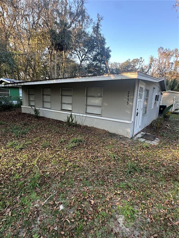 2435 North Junglecamp Road Inverness, FL 34453 - Photo 1 of 13 a backyard of a house with lots of green space