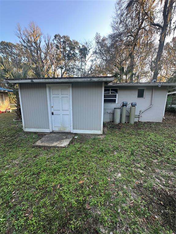 2435 North Junglecamp Road Inverness, FL 34453 - Photo 4 of 13 a house with a tree in the back yard
