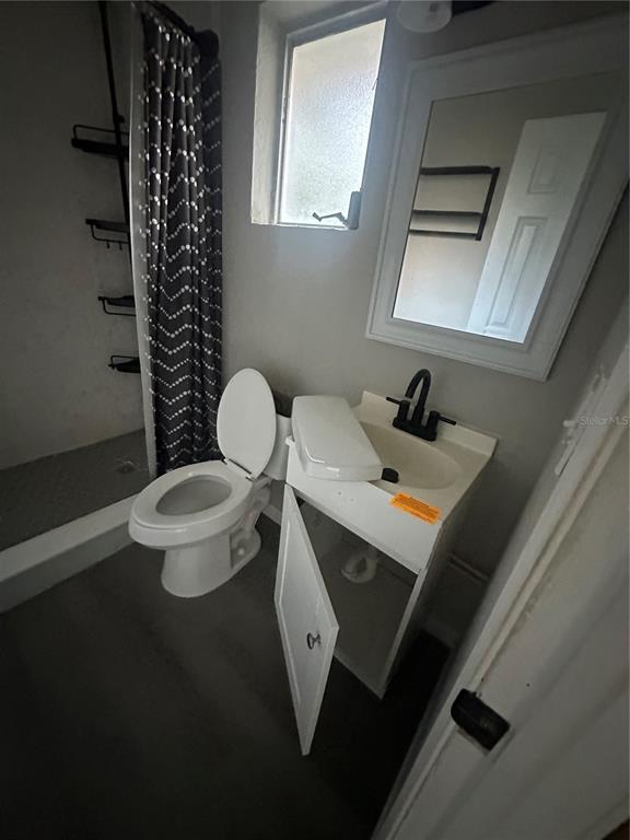 2435 North Junglecamp Road Inverness, FL 34453 - Photo 9 of 13 a bathroom with a sink mirror and toilet