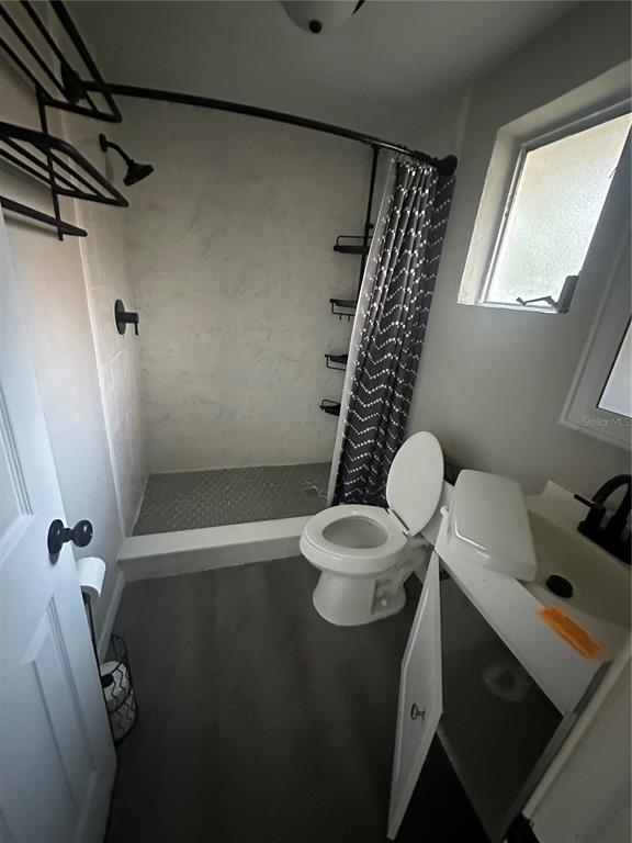 2435 North Junglecamp Road Inverness, FL 34453 - Photo 10 of 13 a bathroom with a sink mirror vanity and toilet