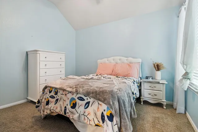 a bedroom with a bed and a cabinets