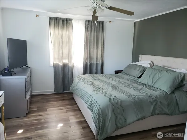 a bedroom with a bed and a window