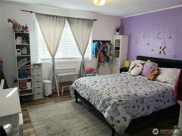 a bedroom with a bed and a closet