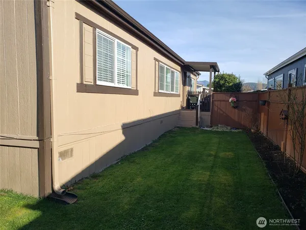 a house with swimming pool in front of it