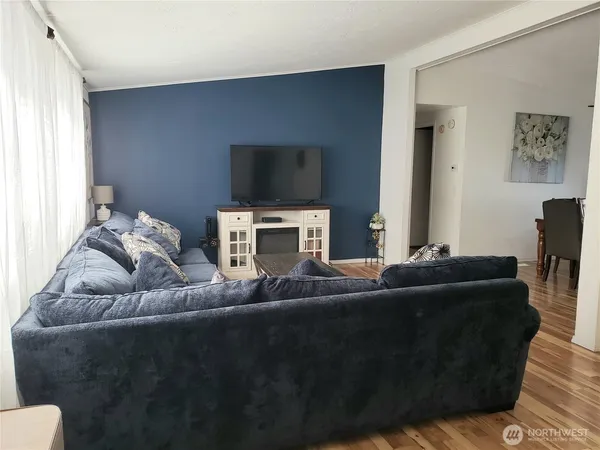 a living room with furniture and a window
