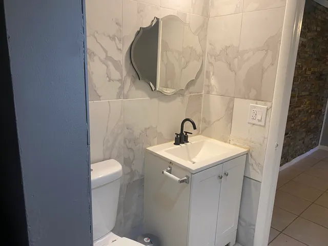 a bathroom with a sink and mirror