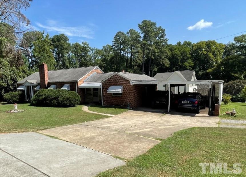 3300 Six Forks Road Raleigh, NC 27609 - Photo 1 of 12 a front view of a house with a yard