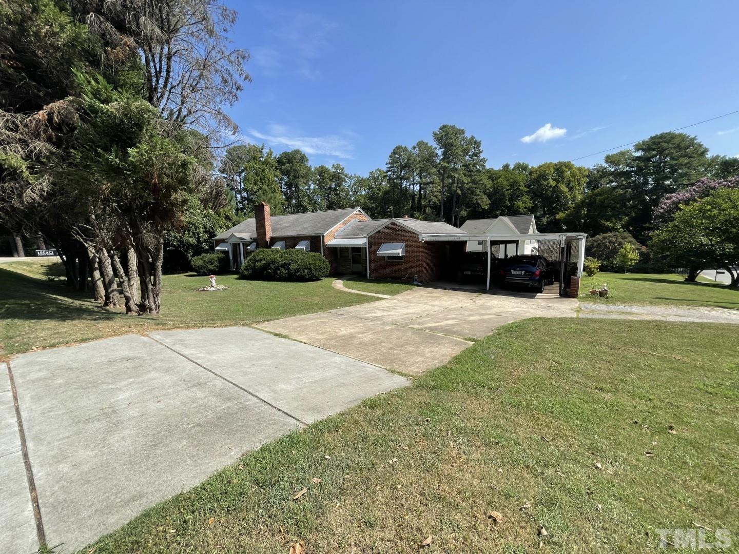 3300 Six Forks Road Raleigh, NC 27609 - Photo 2 of 12 a view of a house with a yard