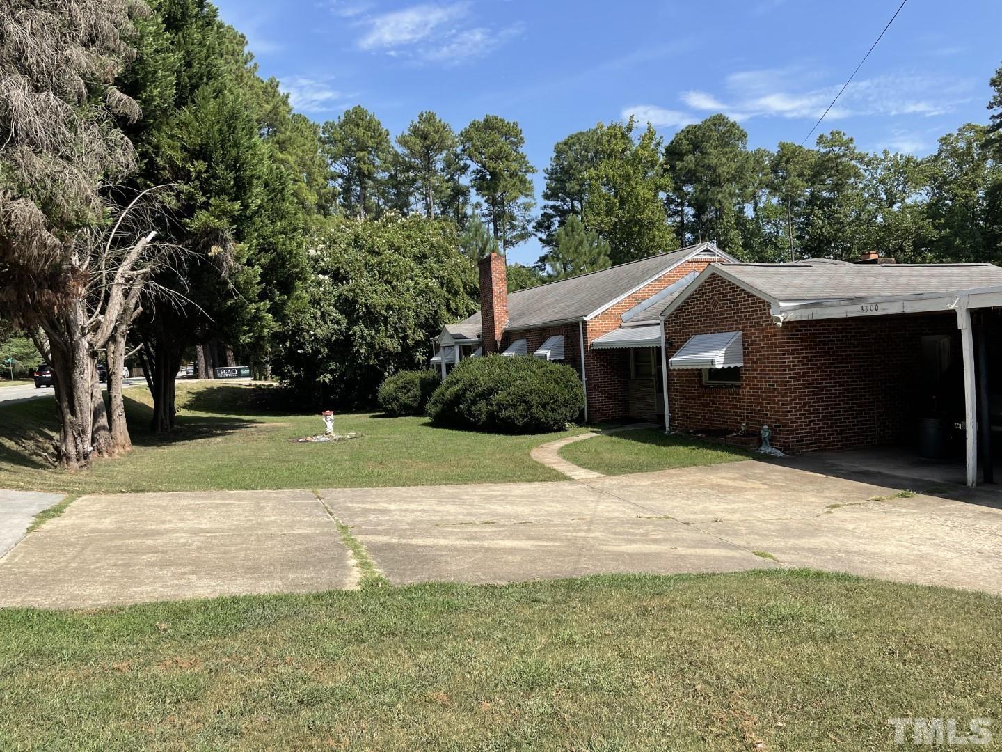 3300 Six Forks Road Raleigh, NC 27609 - Photo 5 of 12 a house with trees in the background