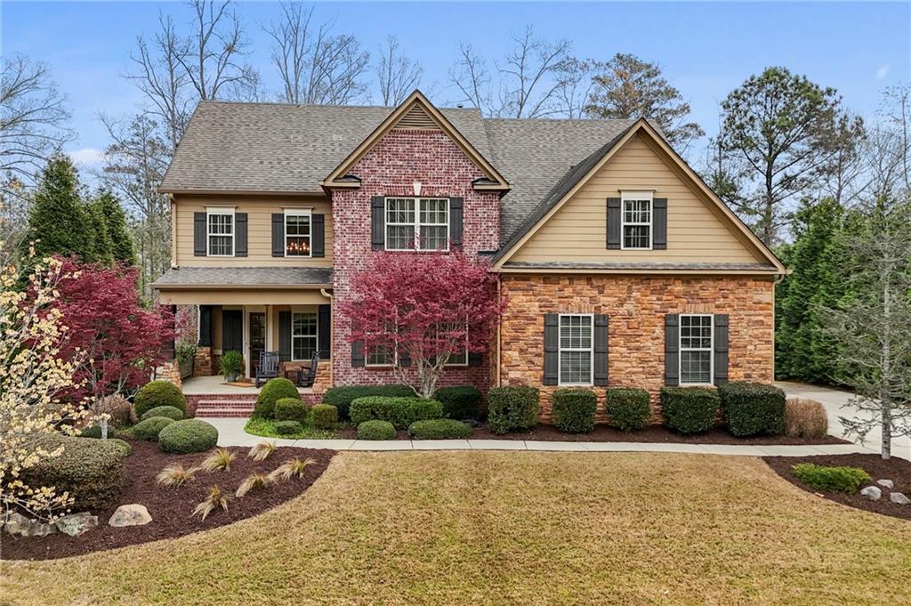 12845 Donegal Lane Milton, GA 30004 - Photo 1 of 1 a front view of a house with garden