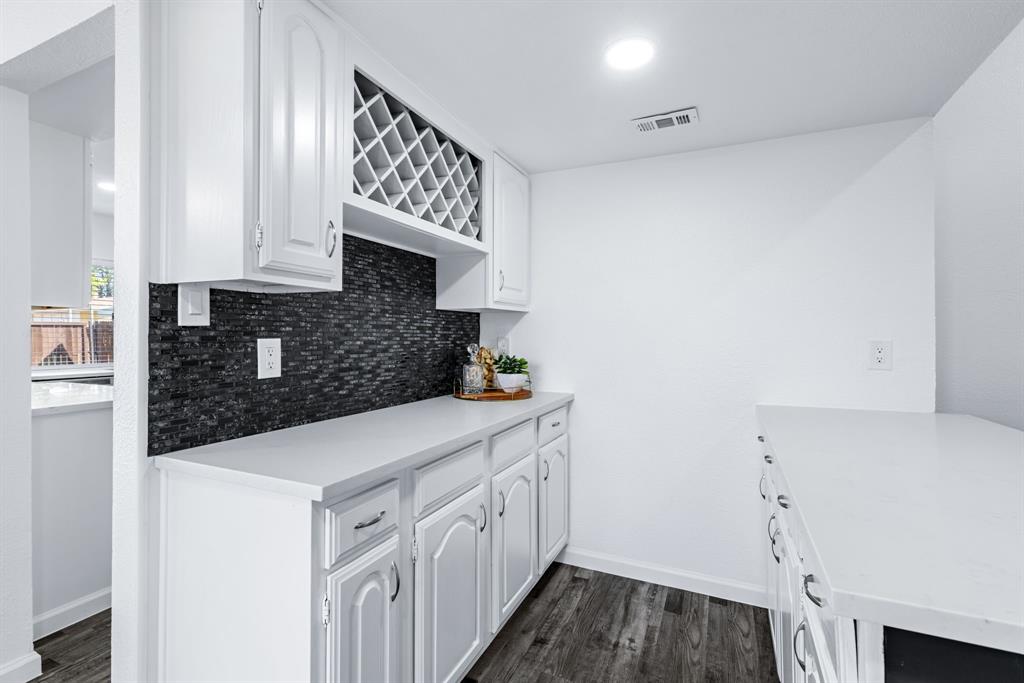 3429 Post Oak Road Garland, TX 75044 - Photo 15 of 36 a kitchen with stainless steel appliances a sink and cabinets